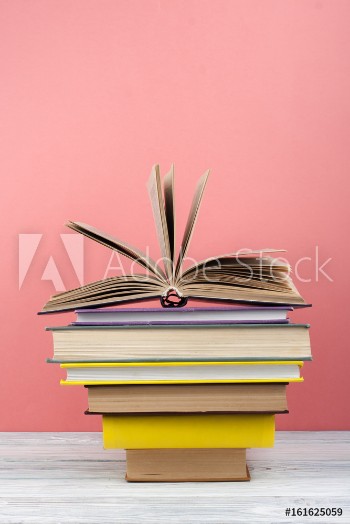 Picture of Open book hardback colorful books on wooden table Back to school Copy space for text Education business concept